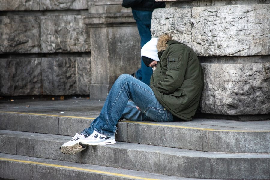 man rough sleeping on a street