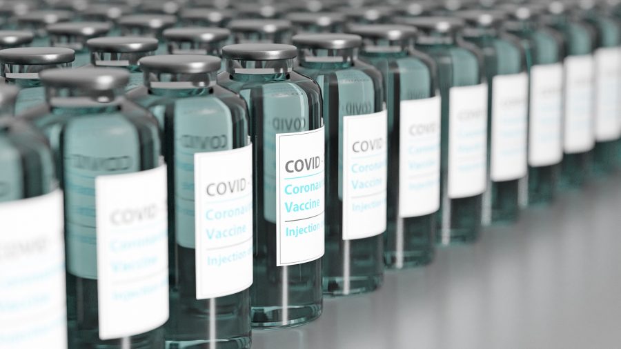 A line of bottles containing COVID-19 vaccine