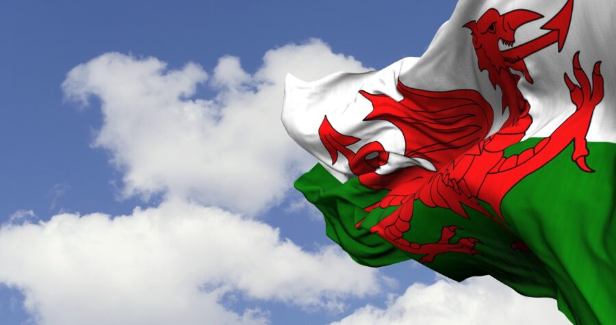 3d illustration flag of Wales. Wales flag isolated on sky background.